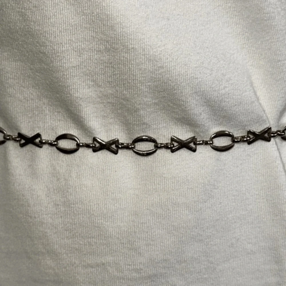 Gold tone XOXO thin metal chain belt